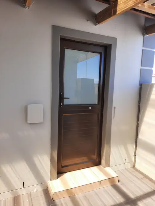 The back door onto the timber threshold