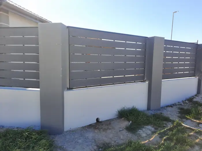 Slatted screen above a solid plastered base