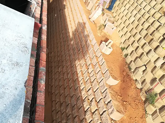 The block retaining wall at House Chapman seen from above