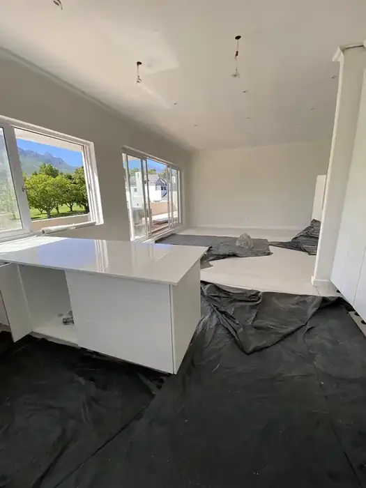 Open plan living and kitchen upstairs, mountains through the windows