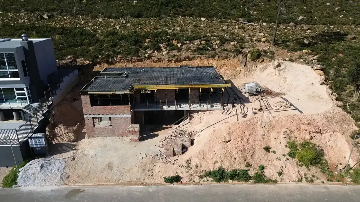 A deep cut into rock on a steep site in Gordon's Bay