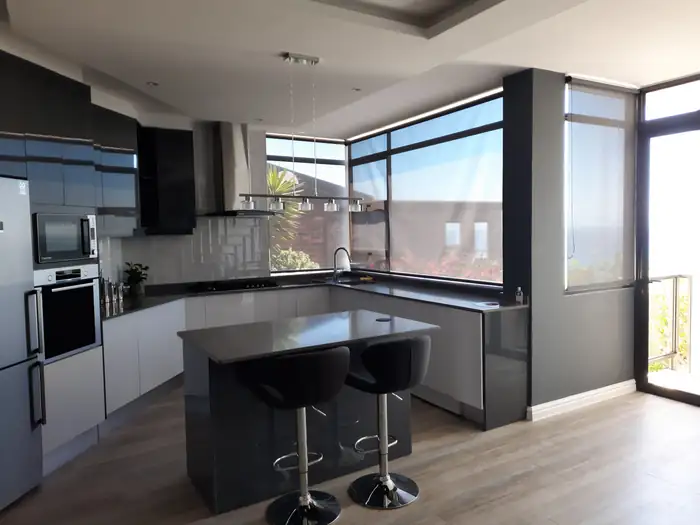 Looking across the kitchen island to the window over the bay