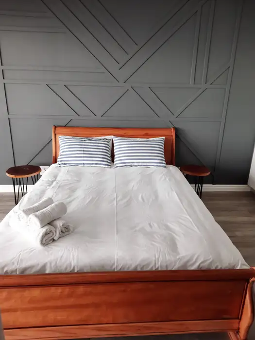 Custom panelling behind the bed in one of the suites